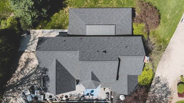 Aerial drone photo of a shingle roof replacement in progress, documented from above